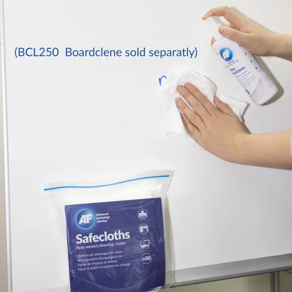 A person is cleaning a whiteboard with Safecloths Non Woven Cleaning Cloths - x50 SCH050.