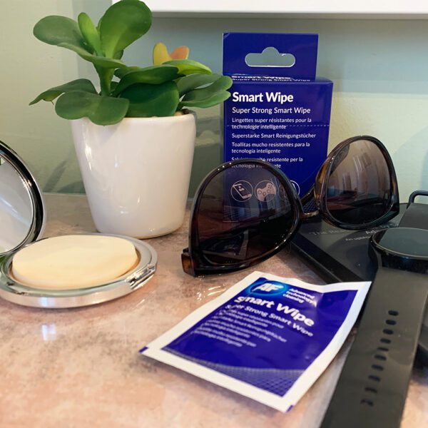 SMARTWIPE10, sunglasses, and a plant on a counter.